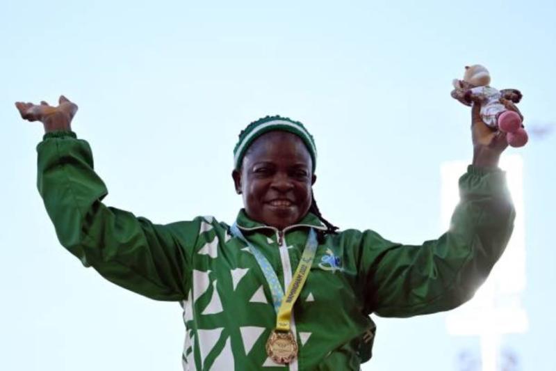 Gold medallist Nigeria's Eucharia Njideka Iyiazi pose during the medal ceremony for the women's F55-57 shot put final athletics event at the Alexander Stadium, on day nine of the Commonwealth Games in Birmingham, central England, on August 6, 2022. (Photo by Ben Stansall / AFP) (Photo by BEN STANSALL/AFP via Getty Images)