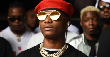 Ayodeji Balogun, better known by his stage name Wizkid, is a musician from Nigeria. When he was young, he created a band with several buddies from church called the Glorious Five and recorded an album.1