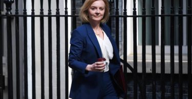 Her birth name is Mary Elizabeth Truss, but she goes by Liz, which is a shortened version of Elizabeth. On July 26th, 1975, she was brought into this world by her parents, Professor John Kenneth Truss and Pricilla Truss. She is the oldest sibling, and her younger brothers are named Chris, Francis, and Patrick.