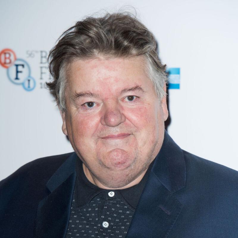 Robbie Coltrane was a Scottish actor and comedian. He was also from Scotland. The role of Rubeus Hagrid in the Harry Potter film series was largely responsible for his rise to fame in the 2000s. Anthony Robert McMillan is his actual name in real life. He passed away on October 14, 2022, when he was 72 years old. It was on March 30th, 1950 that he was born.