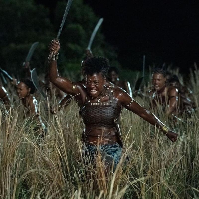 The Agojie were a female warrior unit supported by the West African kingdom of Dahomey between the 17th and 19th centuries, and they are the focus of the American historical epic film The Woman King, set to be released in 2022. Viola Davis plays a general who prepares the next generation of soldiers to fight in the 1820s setting of the film. The screenplay and direction are both by Dana Stevens and Gina Prince-Bythewood. The screenplay was co-written by Dana Stevens and Maria Bello. Sheila Atim, John Boyega, Thuso Mbedu, and Lashana Lynch all have roles in the film.