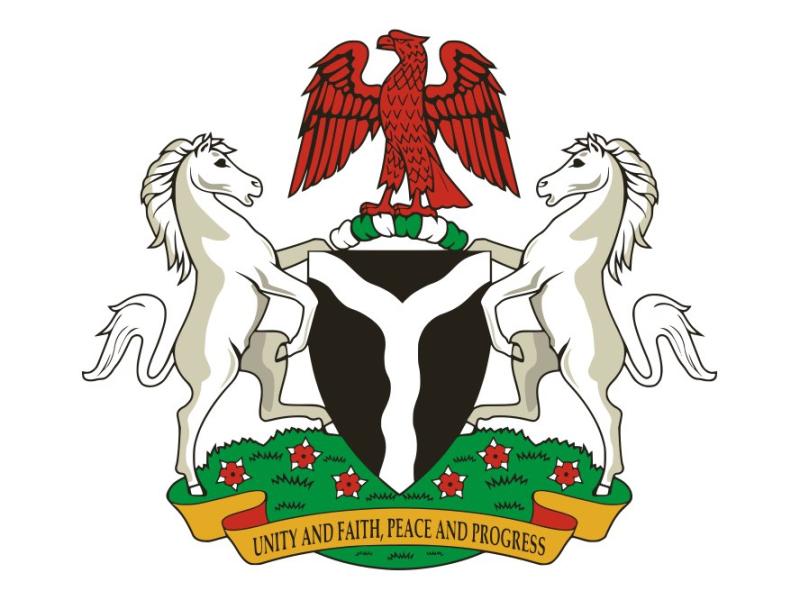 Nigeria's coat of arms features a black shield with a white, wavy pall that represents the confluence of the Niger and Benue Rivers in the city of Lokoja.